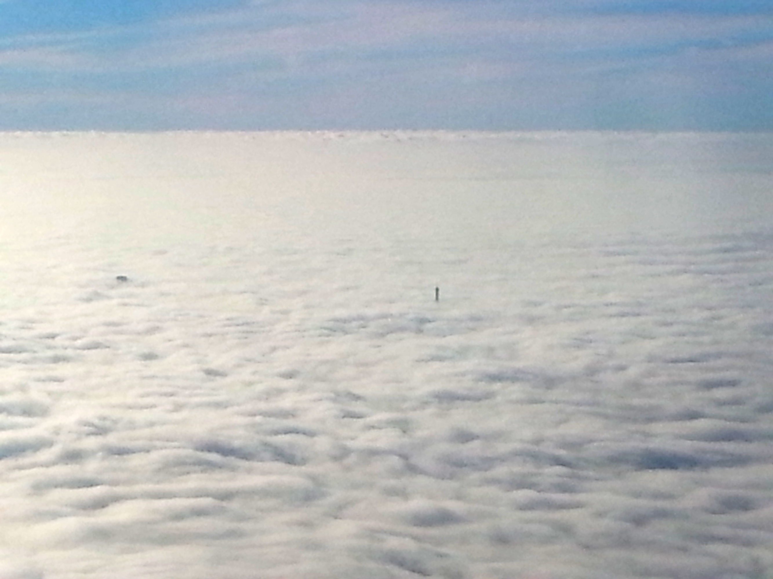 Amazing: Tour Eiffel's summit rising through the low clouds over Paris