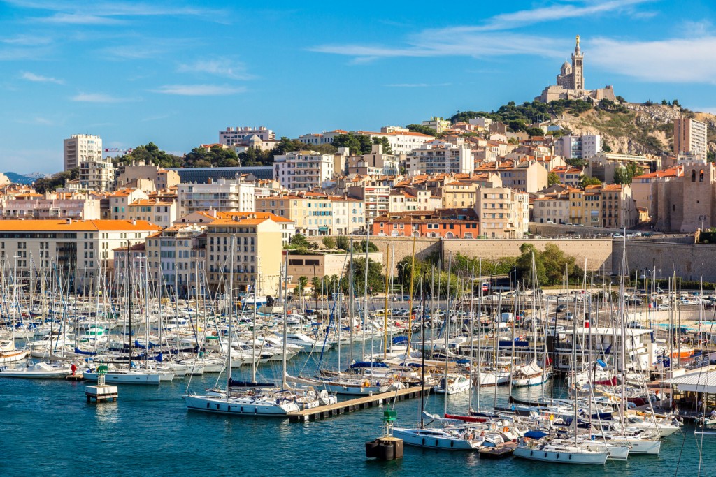 Aerial panoramic view on basilica of Notre Dame de la Garde and old port in Marseille, France