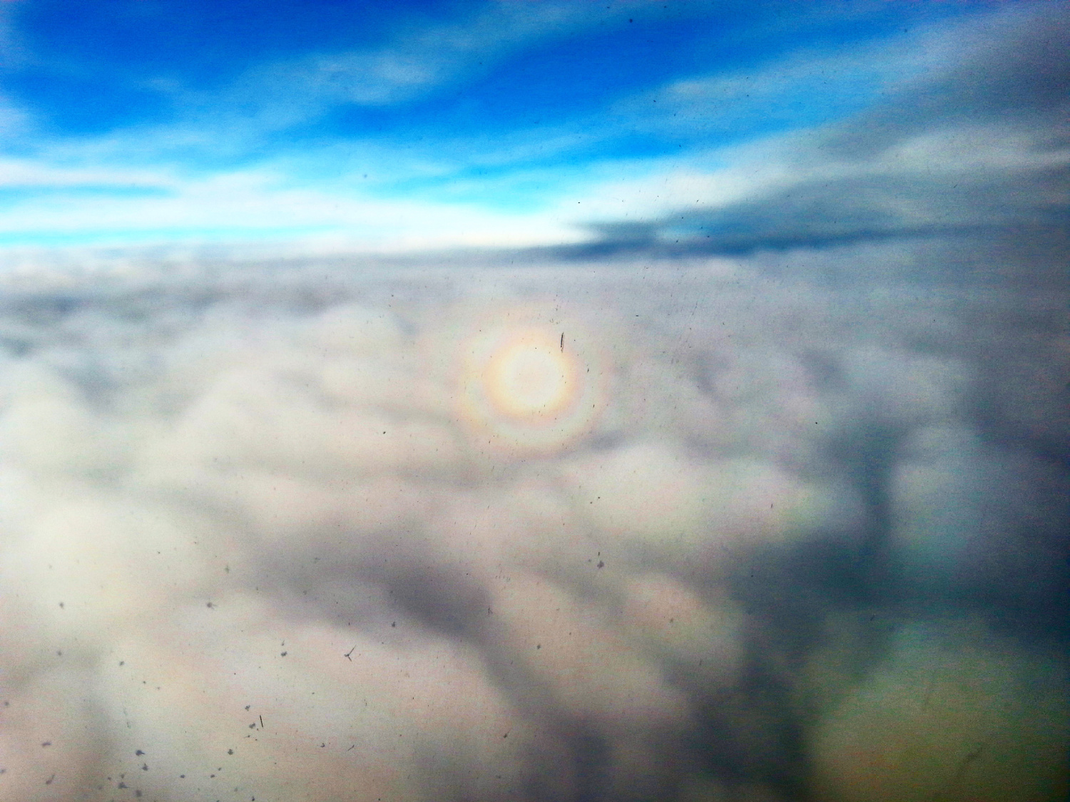 Triple circular rainbow seen from an airplane