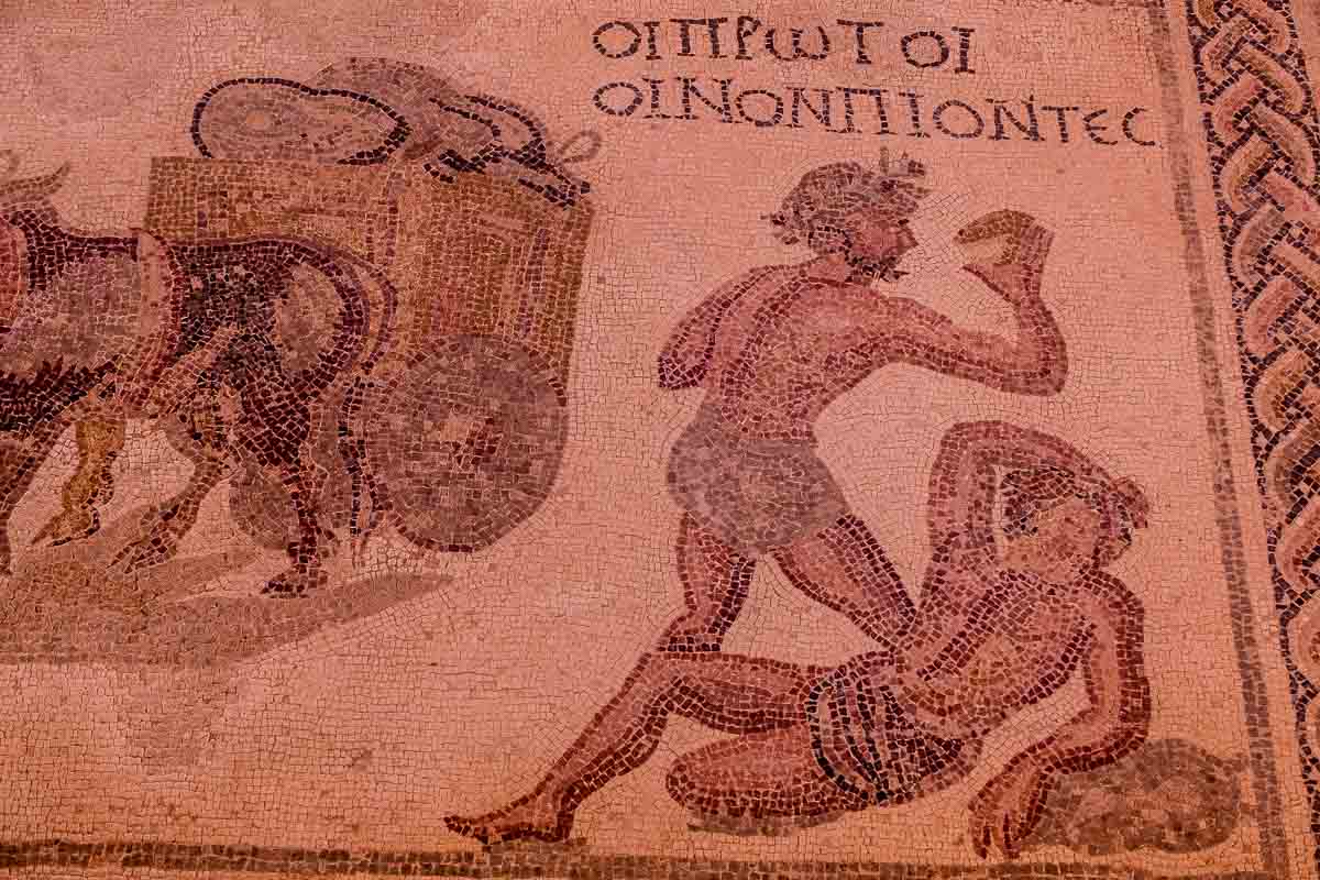 A mosaic from the House of Dionysius. The legend says "The first wine drinkers" in ancient Greek - Paphos, Cyprus is one of the best UNESCO monuments in Europe. Read the article to discover more natural sites in Europe, and a list of world heritage in Europe to add to your bucket list. #UNESCO #unescosites #unescositeseurope #europeunesco #cyprusunesco #cyprus