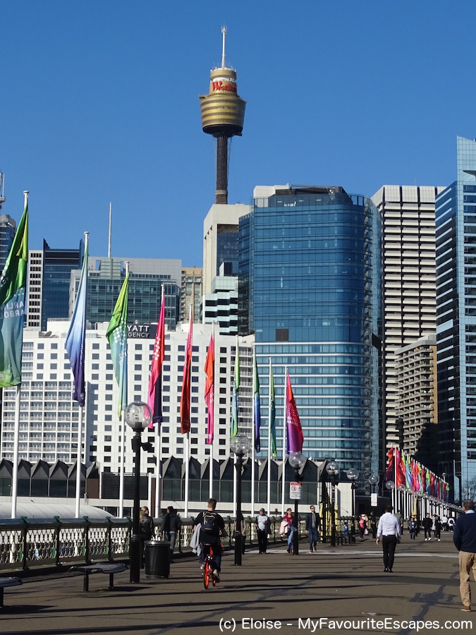 Sydney Tower from Darling Harbour, Sydney, Australia. Read this Sydney travel plan and find out what to see in Sydney in 3 days. #sydney #australia #sydneyaustralia #sydneyguide #sydneyitinerary #sydneytraveling #australiatraveling #sydneytravelguide