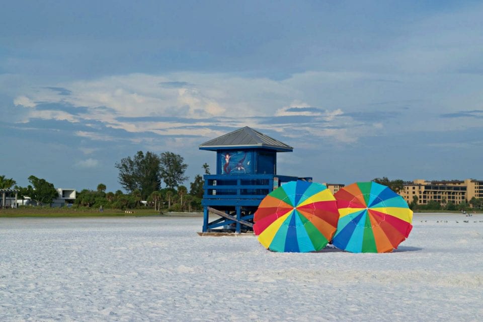 Umbrellas at Siesta Key Beach. Discover 7 Florida attractions with a secret past
